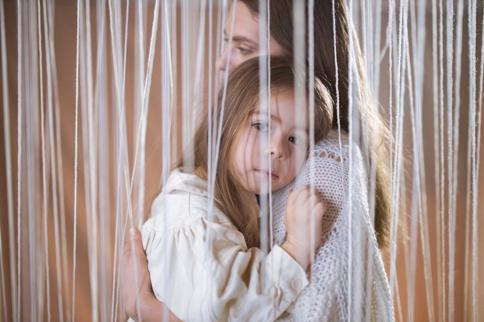 A warm embrace captures the bond between mother and daughter, creating a tender and intimate moment. A warm embrace captures the bond between mother and daughter, creating a tender and intimate moment.