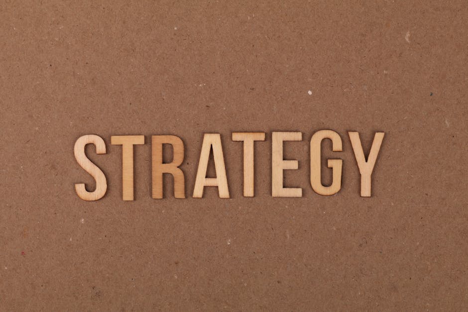 Wooden letters spelling ‘Strategy’ on a cardboard background, perfect for business concepts. Wooden letters spelling 'Strategy' on a cardboard background, perfect for business concepts.