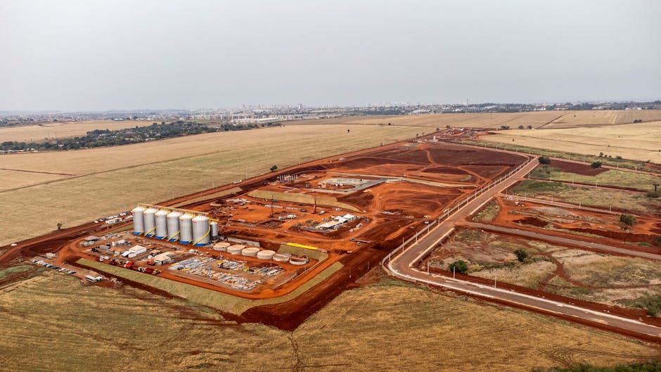 Explore this aerial shot of an expansive construction site in Londrina, Brazil, showcasing ongoing industrial development. Explore this aerial shot of an expansive construction site in Londrina, Brazil, showcasing ongoing industrial development.