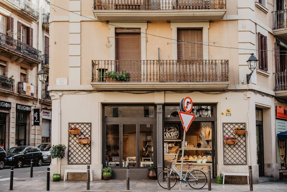 Charming bakery shopfront with vintage bicycle on a quaint street in Barcelona. Charming bakery shopfront with vintage bicycle on a quaint street in Barcelona.