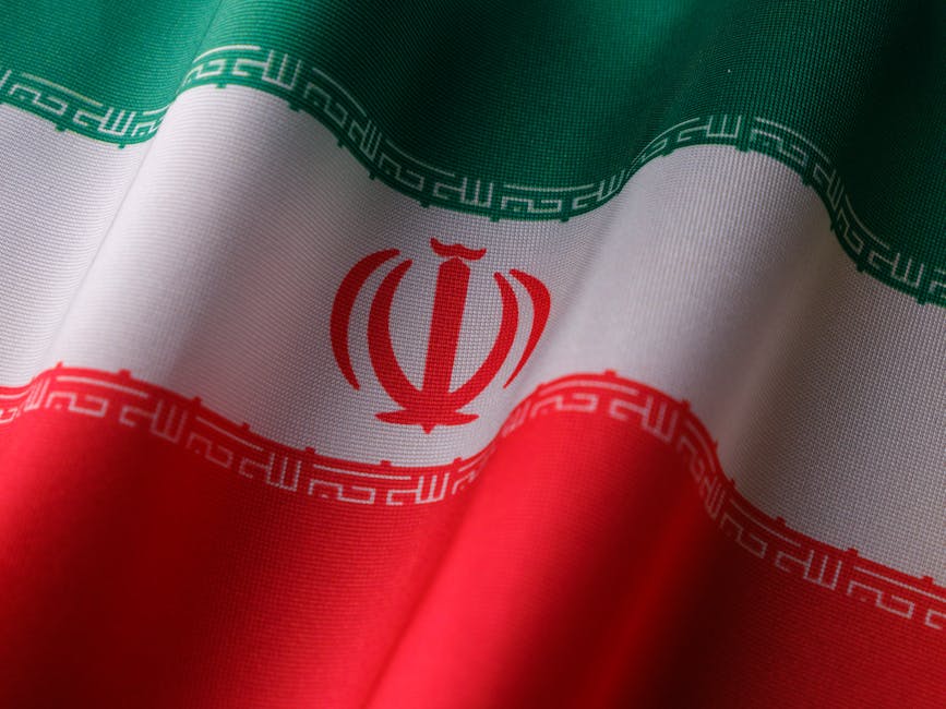 High-quality image of the Iranian national flag waving to symbolize patriotism and national pride. High-quality image of the Iranian national flag waving to symbolize patriotism and national pride.