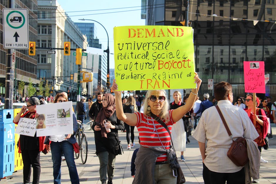 Demonstrators gather in Vancouver advocating for universal political rights. Peaceful protest captured during the day.